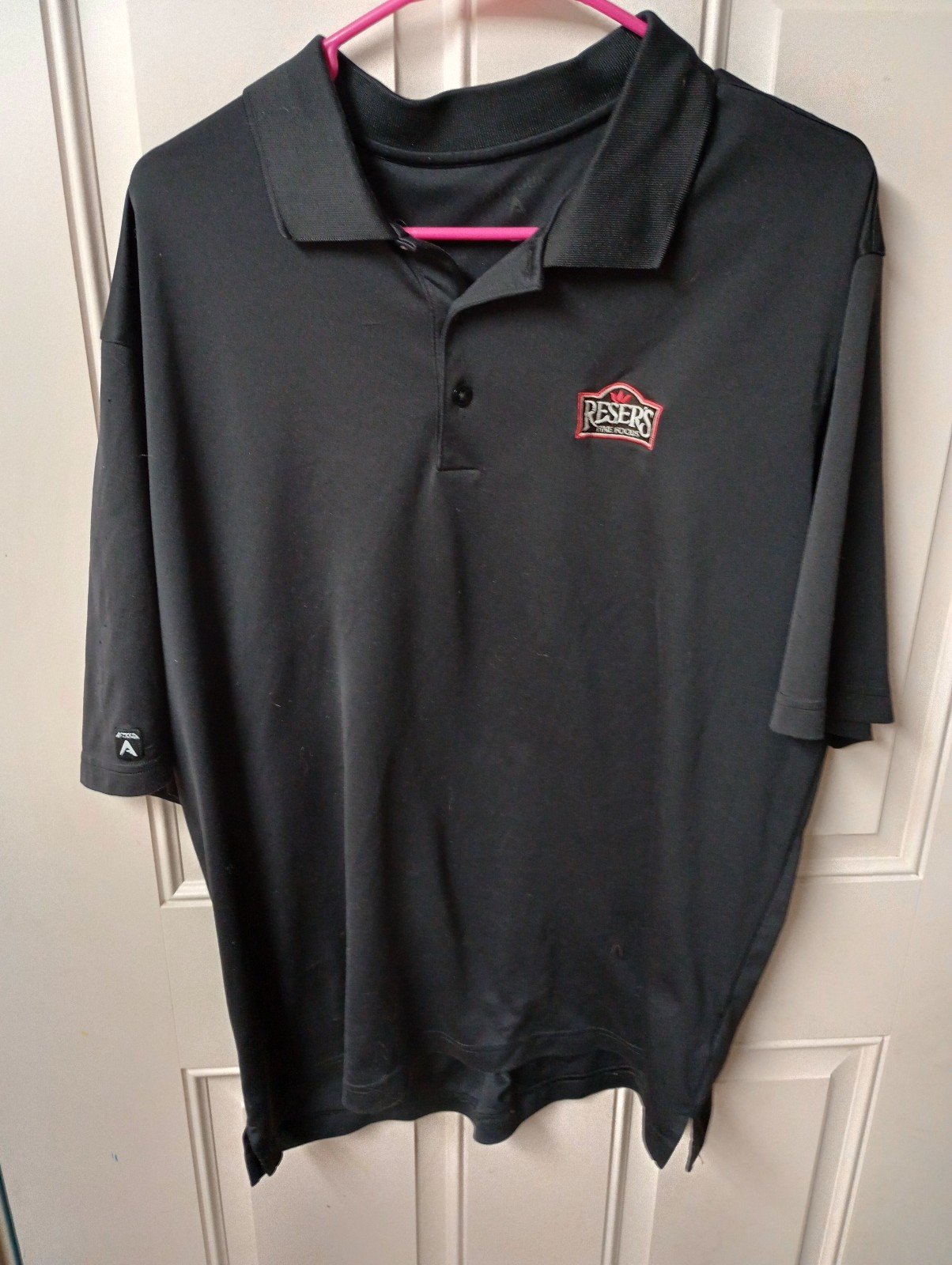 Resers Fine Foods Employee Work Embroidered SS Polo Shirt. Black Partial Button